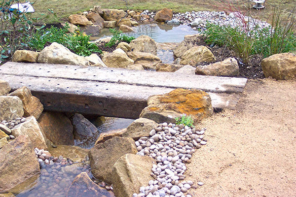 Water feature, with oak sleeper bridge