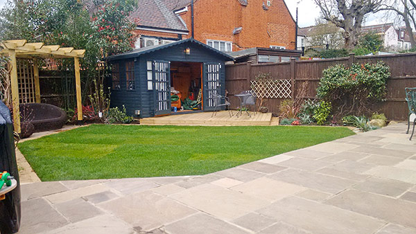 New patio, soft landscaping and refurbished summer house